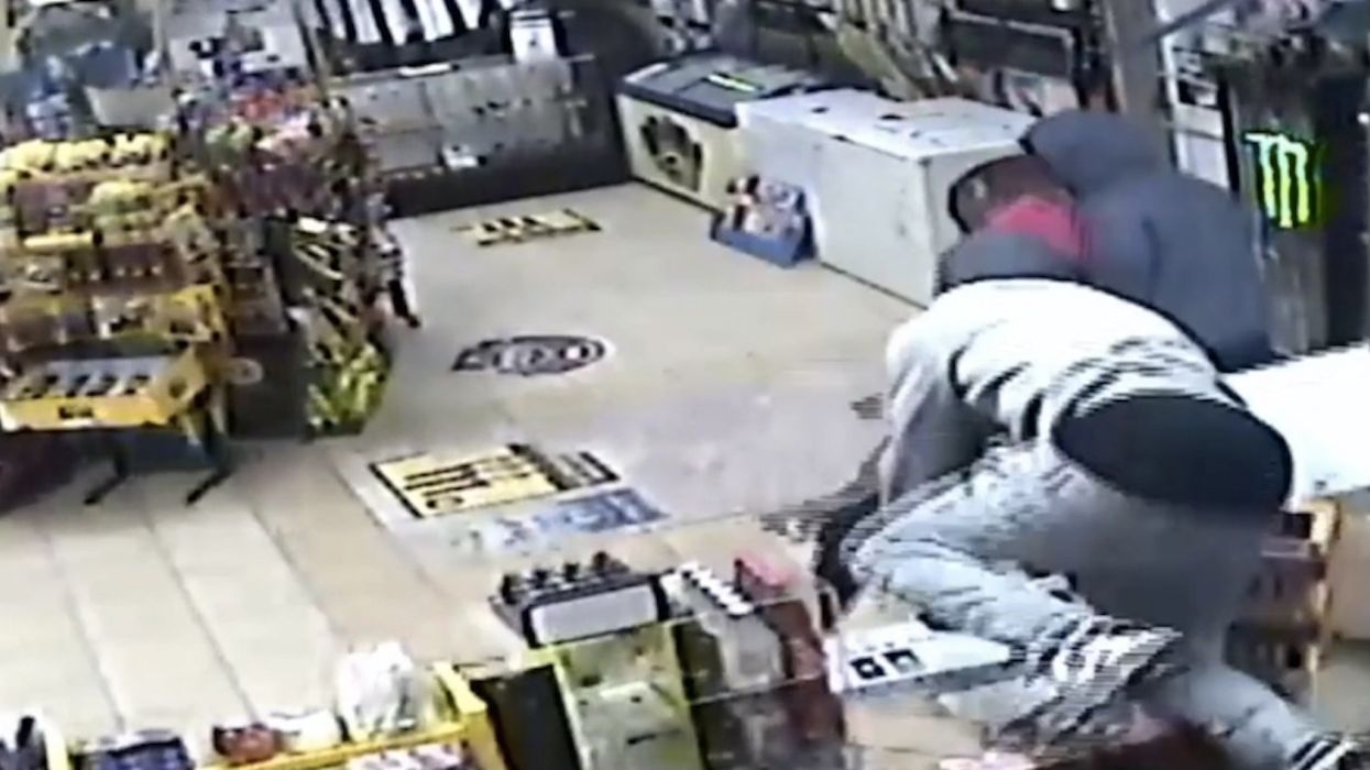 WATCH: Masked robbers run scared when convenience store clerk fights back
