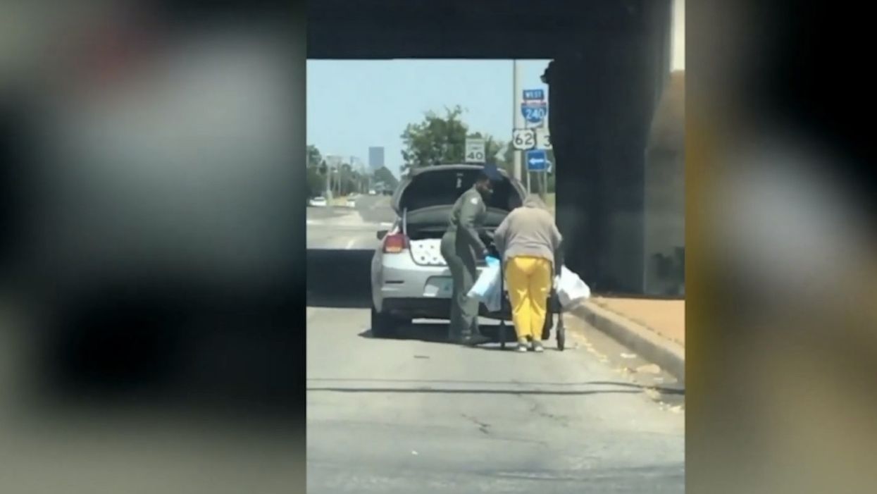 Airman sees elderly woman carting groceries with her walker along busy road on 100-degree day — and he literally goes the extra mile