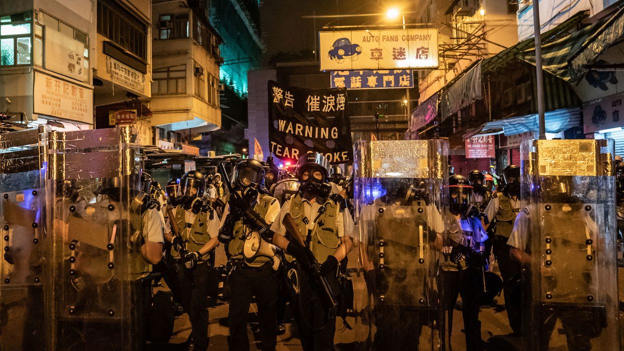 Chinese armored vehicles parked outside Hong Kong fuel fears of military crackdown against protests