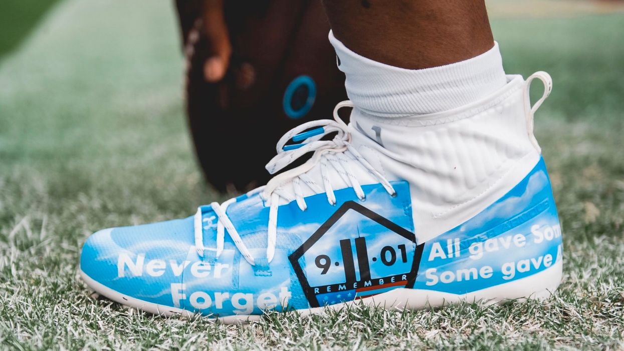Panthers' Cam Newton wears a tribute to 9/11 first responders before Thursday night game