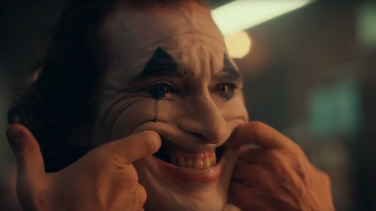 Aurora shooting victims' families demand Warner Bros. help curb gun violence as 'Joker' movie gets set to hit theaters. Lead actor doesn't hold his tongue.
