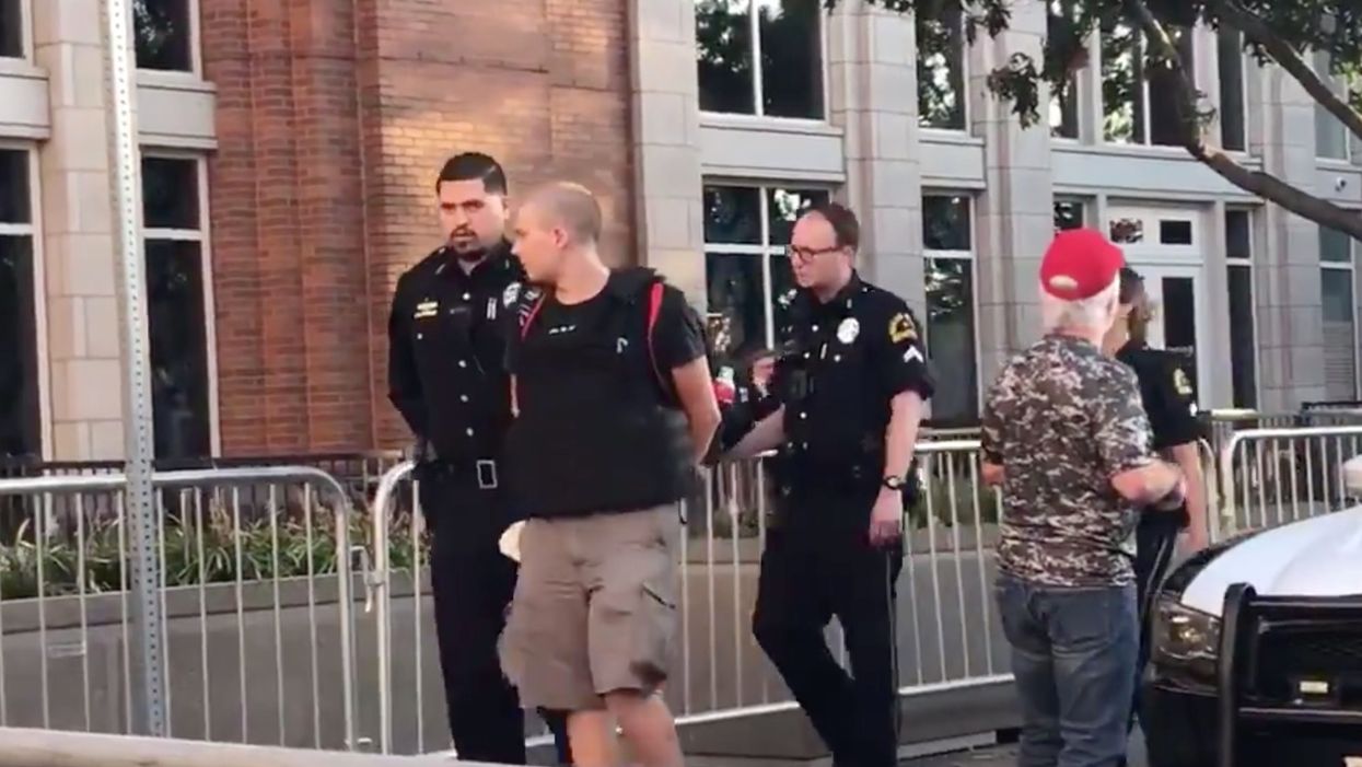 Man with a gun arrested near protesters outside Trump's Dallas rally