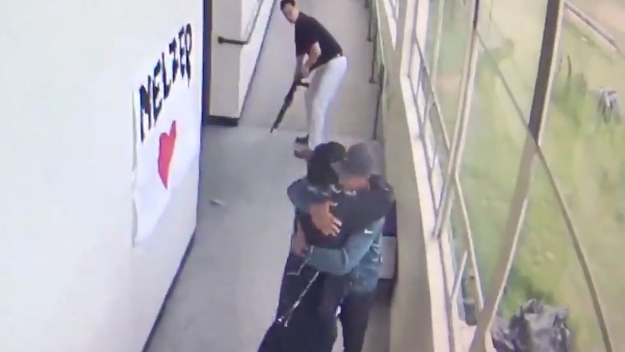Incredible video shows moment HS coach disarms student with shotgun — and embraces him with bear hug