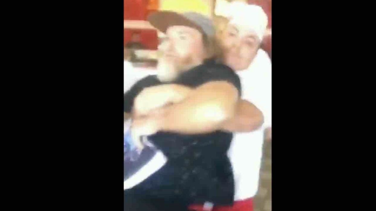 In-N-Out Burger employee carries bullhorn-wielding protester out of restaurant. Then police arrive, take action — and demonstrators lose it.