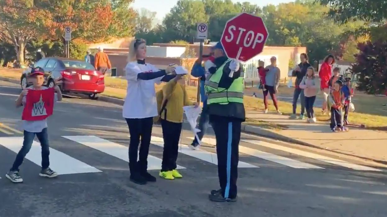 Students and families surprise school crossing guard with World Series tickets