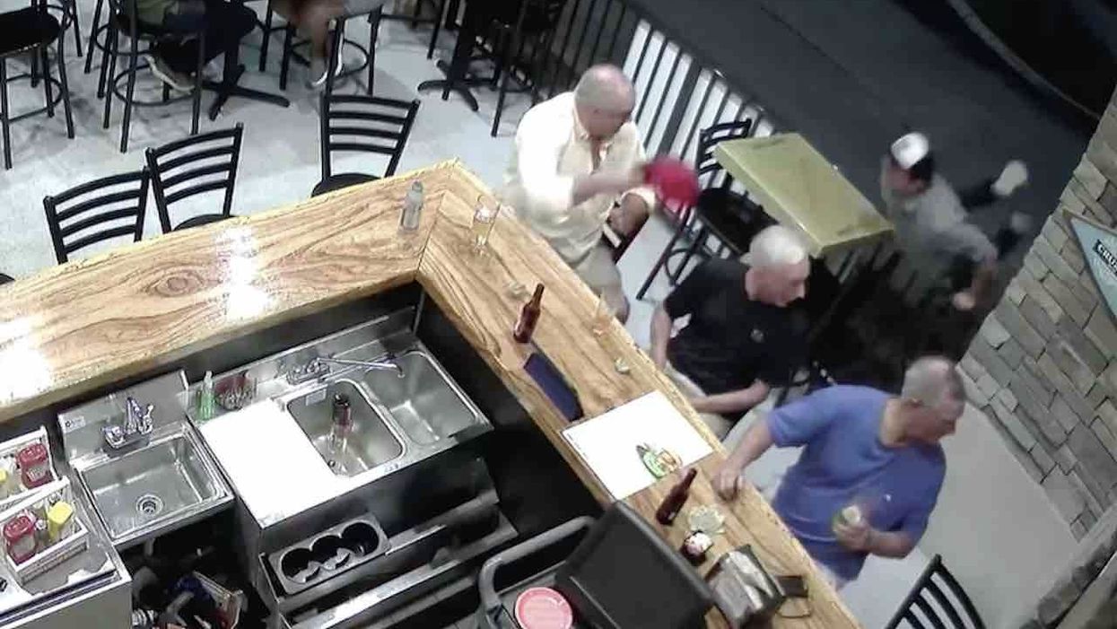 New surveillance video released in case of man accused of spitting on MAGA-hat wearer