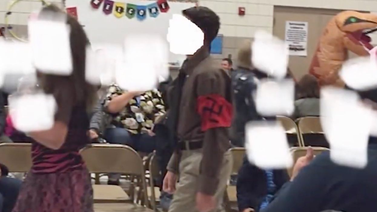 Principal and teacher reinstated after probe into grade school student who wore Nazi costume to Halloween parade