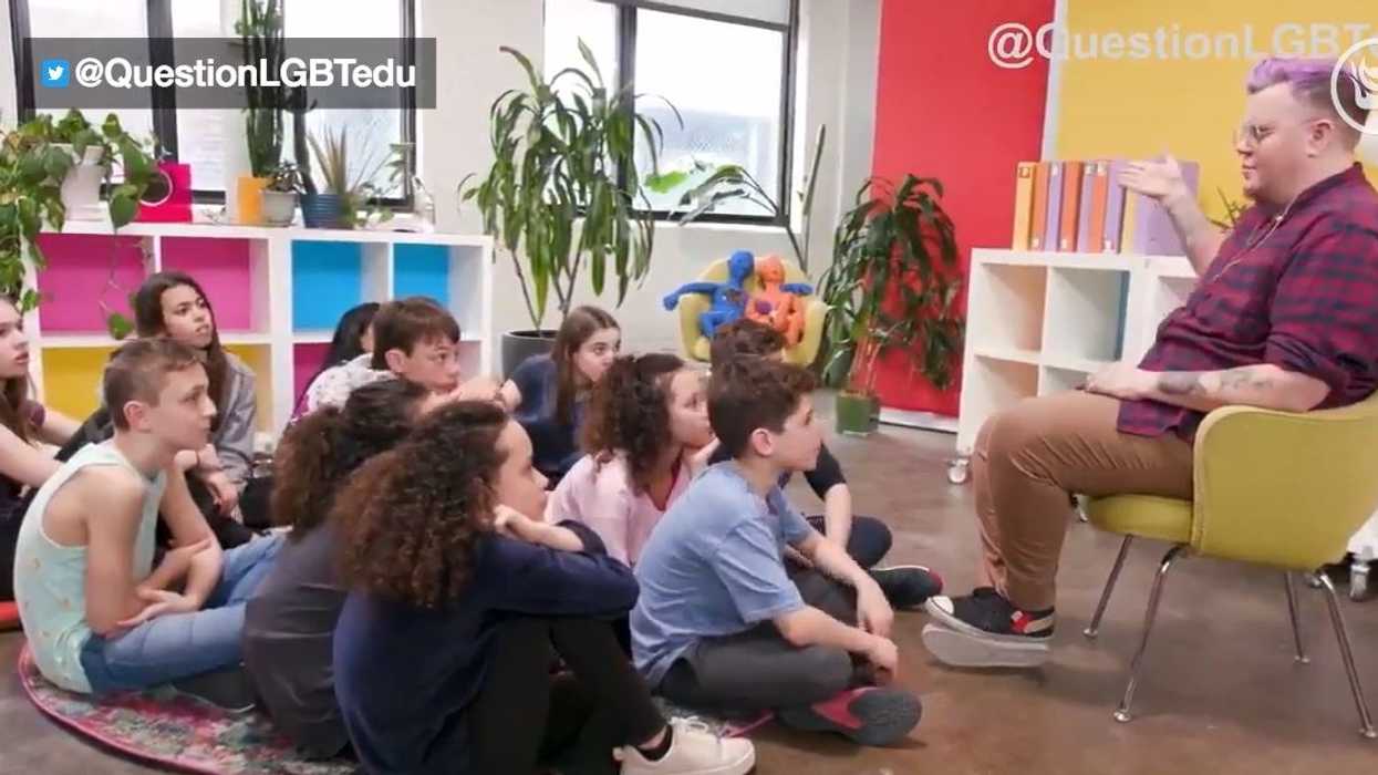 Drag king explains to a group of young students why 'he' transitioned