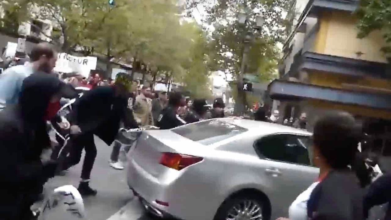 Bouncer with 'Antifa' stun gun arrested for allegedly smashing car with metal baton when violent leftists ran wild in Portland streets last year