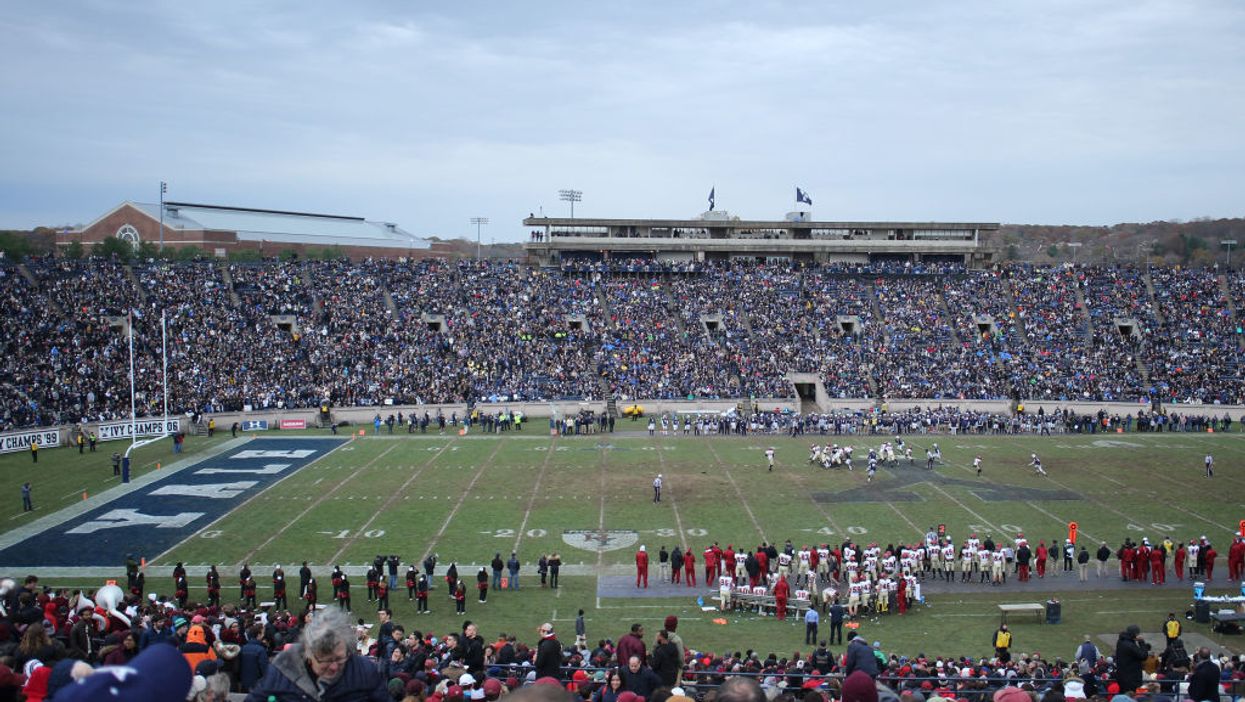 Video: Police forcibly remove climate change protestors who stormed the field during Harvard-Yale football game