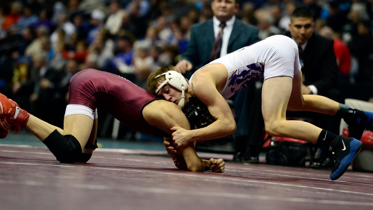 School board fires doctor after he says girl doesn't belong on boys wrestling team. Doctor hits back and says that's not the full story.