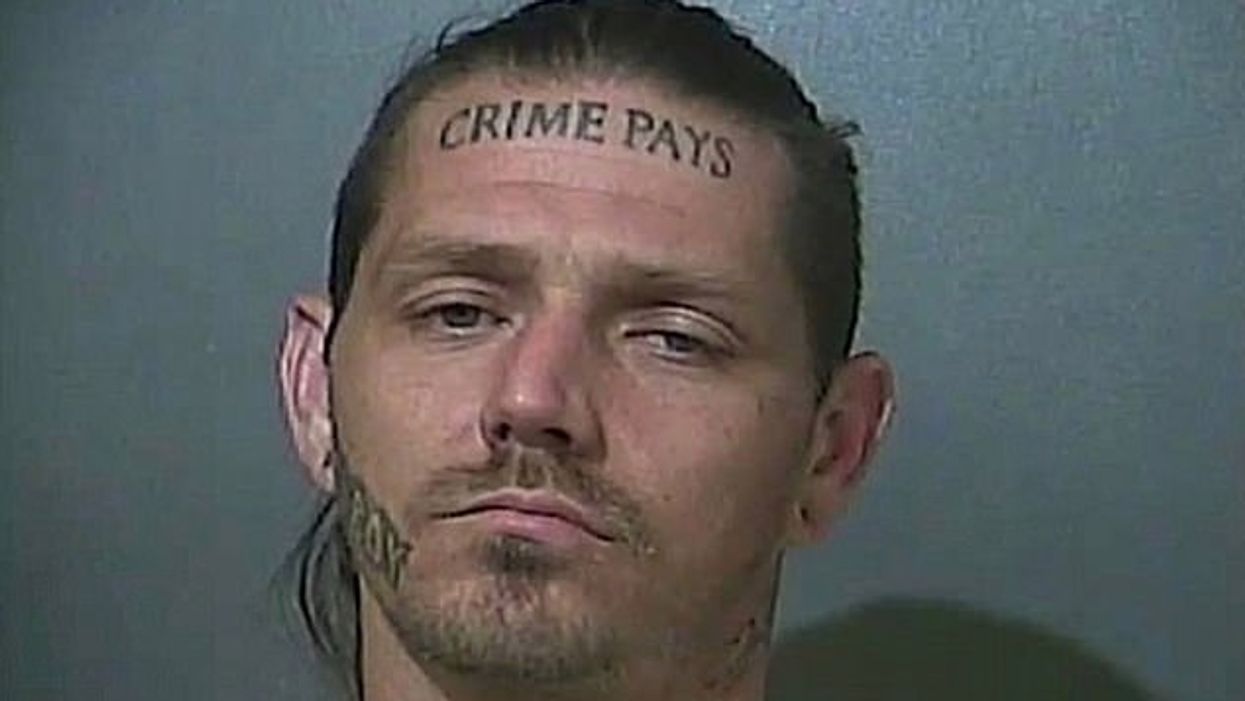 Police search for suspect with 'Crime Pays' tattoo on forehead