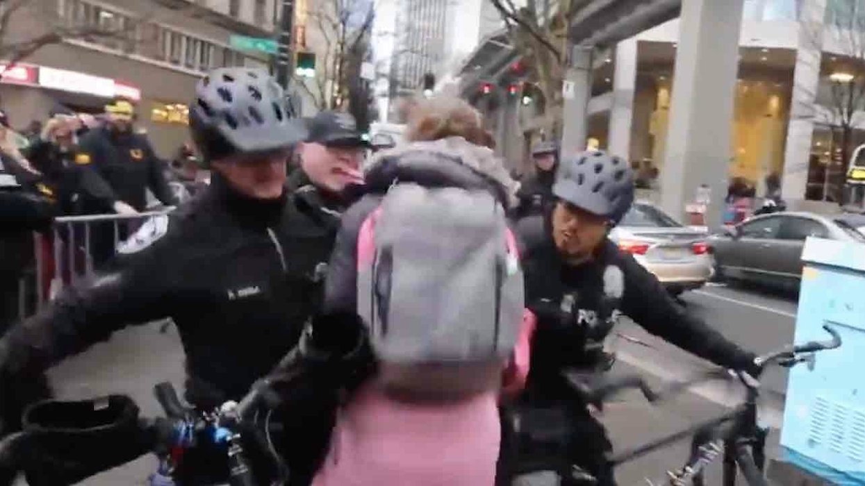 Woman protesting with Antifa tries rushing police line. But cops aren't playing — and shove her right to the pavement.