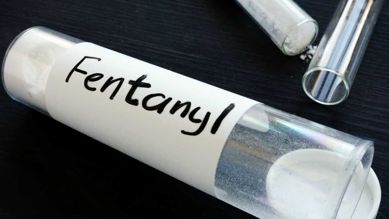 An alleged drug dealer threw fentanyl powder at a cop's face, prosecutors allege