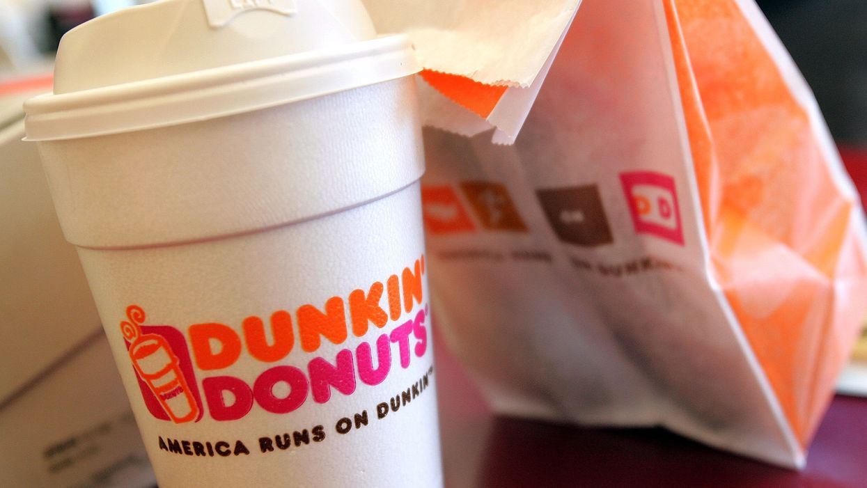 Police officer sues Dunkin' Donuts after employee spit into his coffee. The employee insists it wasn't because he was a cop.