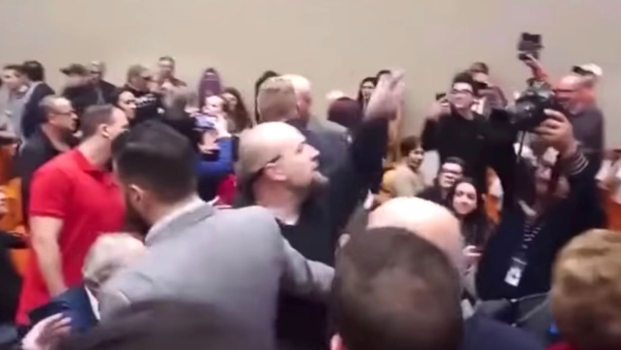 Brawl breaks out at Adam Schiff speech after protesters unfurl Trump 2020 flag — and it's all on video