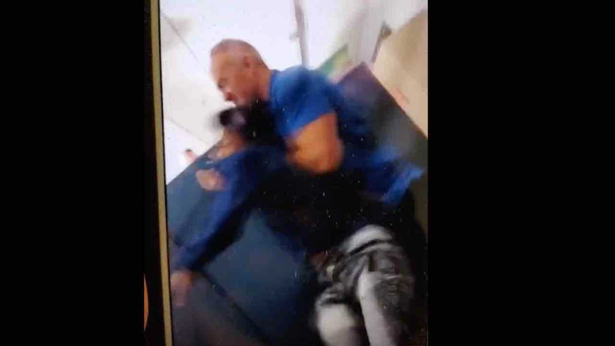 Teacher with previous battery conviction arrested after grabbing unruly student, 14, carrying him to classroom door, shoving him into hallway