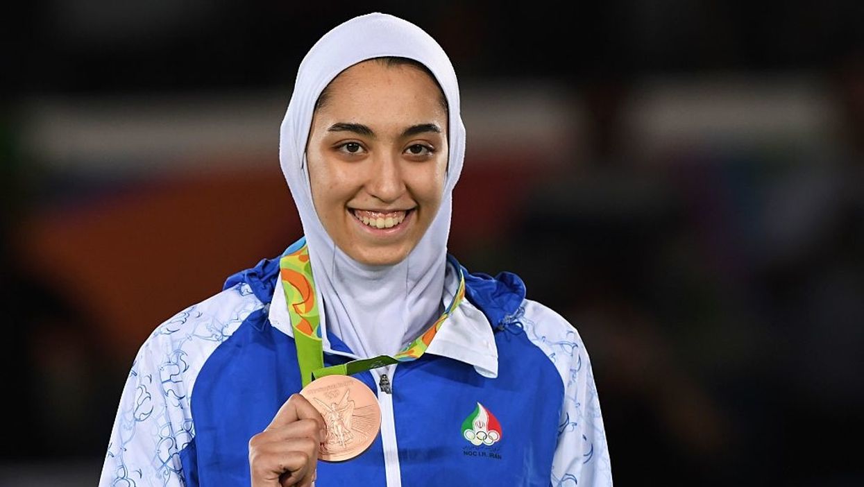 Iran's only female Olympic medalist announces her defection from Iran in scathing message
