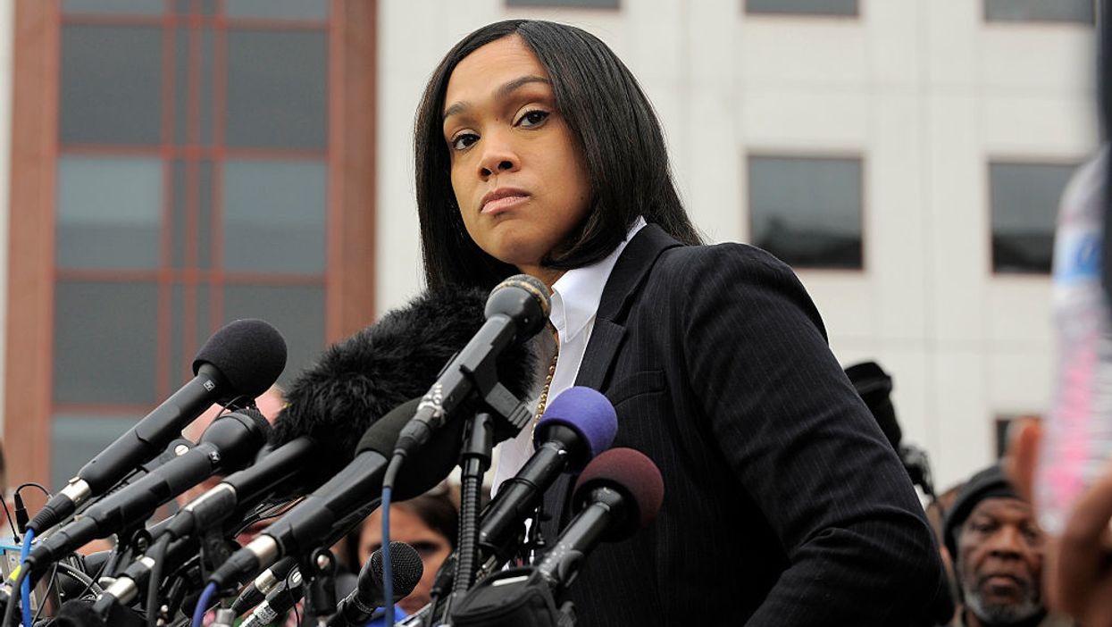 Baltimore state's attorney lashes out at police over video showing angry mob attacking police officer
