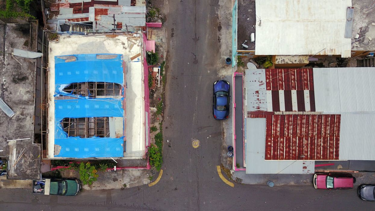 Head of Puerto Rico's emergency services fired after unused hurricane supplies discovered