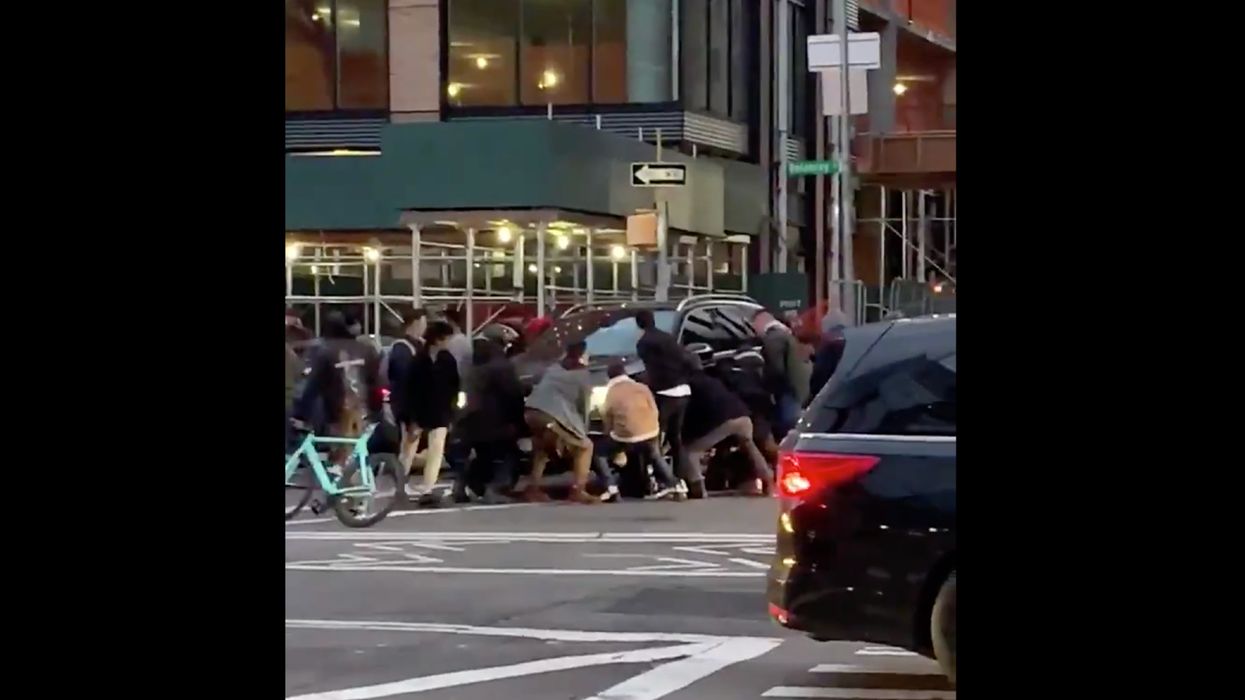 Viral video shows group of New Yorkers banding together to lift a car off a woman who was run over
