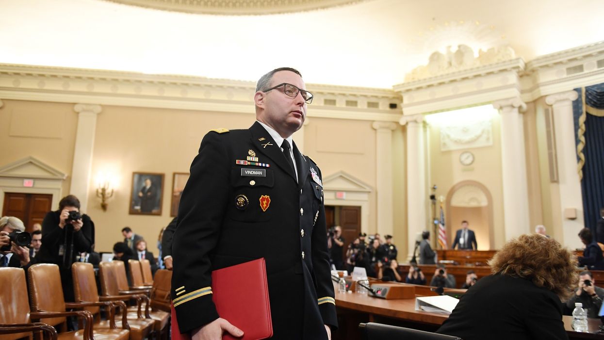 Impeachment witness Lt. Col. Alexander Vindman escorted from the White House