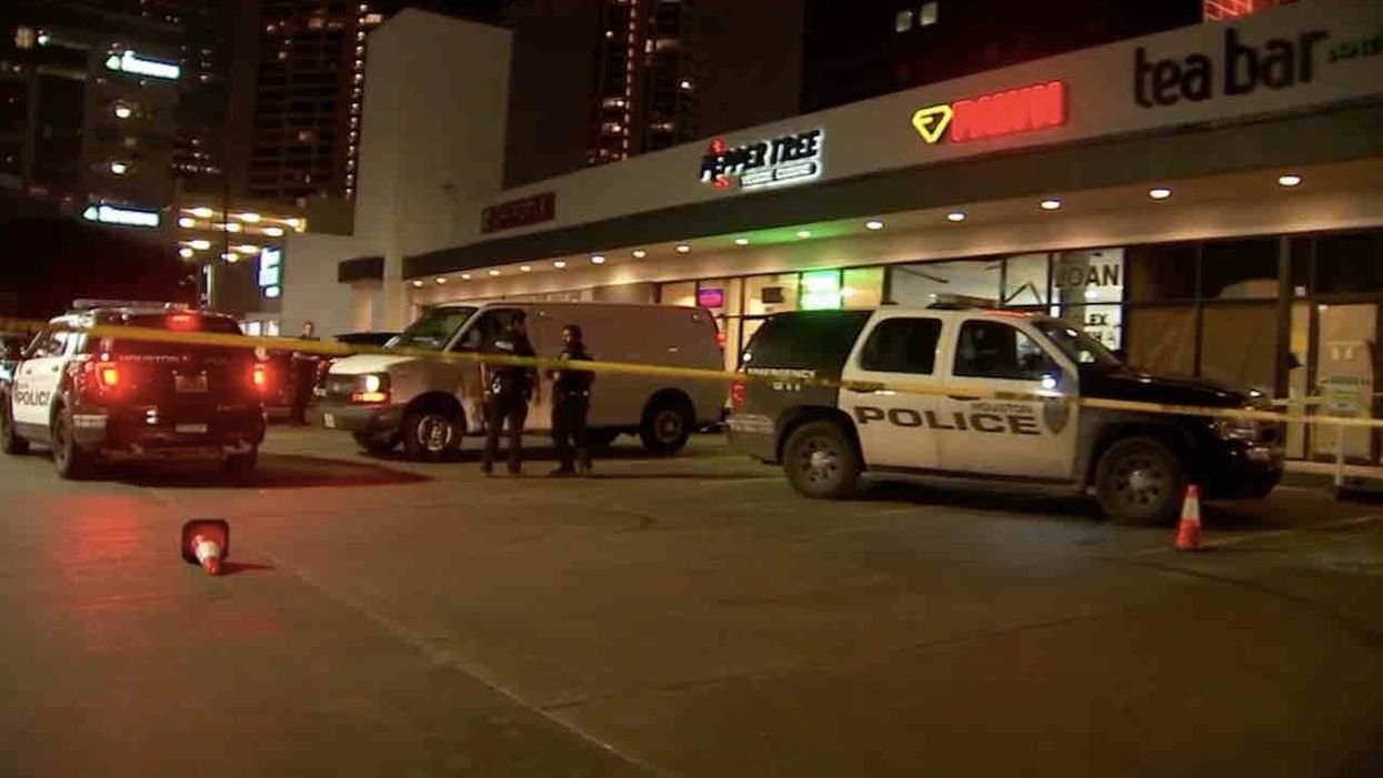Two armed men enter pawn shop; one jumps over counter, points gun at employee. But a clerk grabs his own gun — and fatally turns the tables.