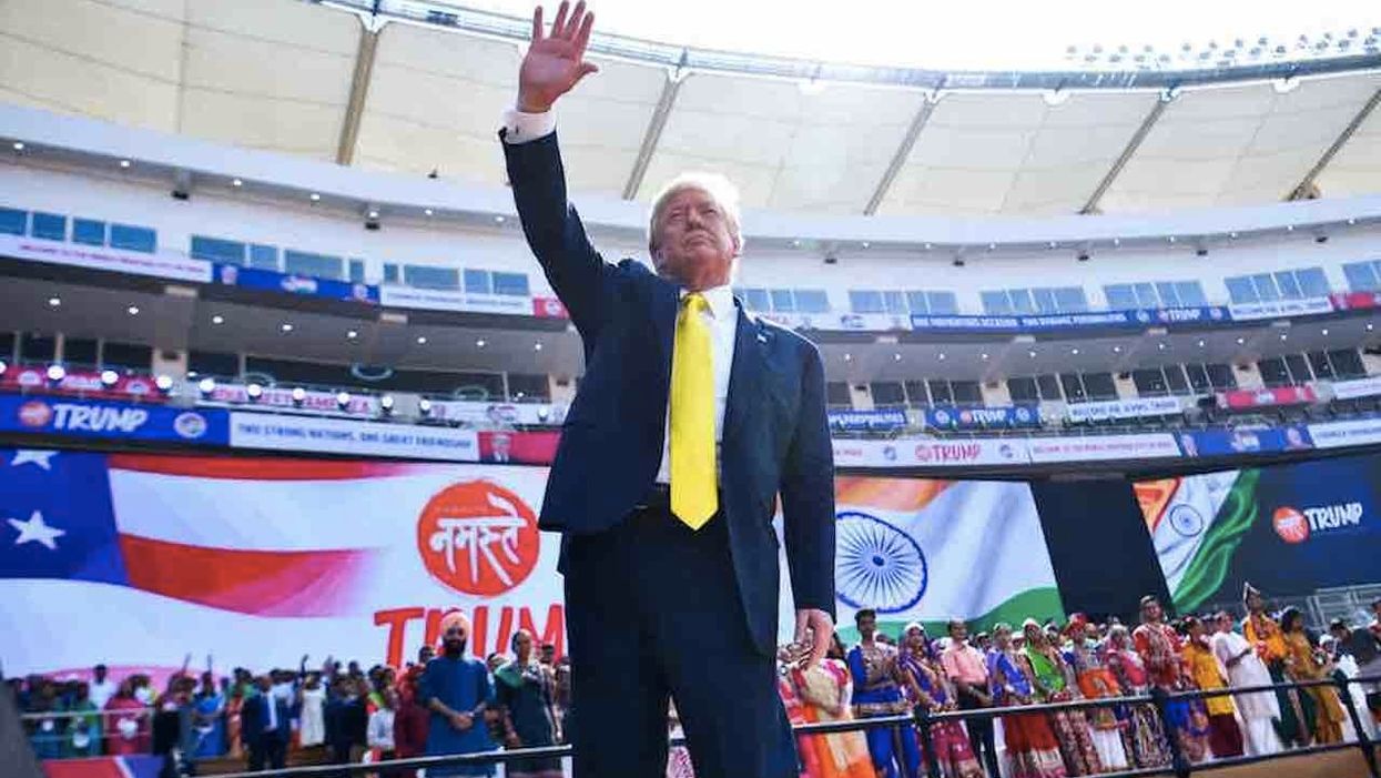 'Macho Man' rings out for President Trump as over 100,000 wearing white Trump hats pack India stadium and cheer his arrival