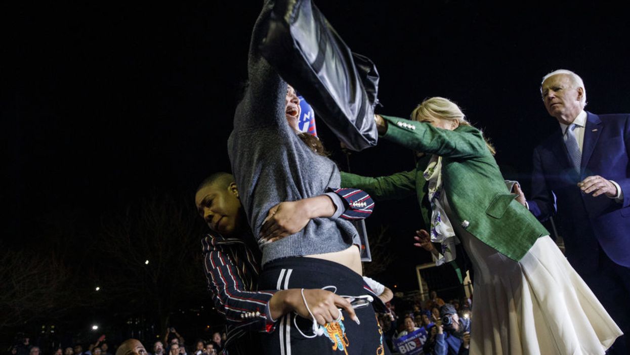 VIDEO: Top Joe Biden adviser tackles protester who storms stage during Biden's victory speech