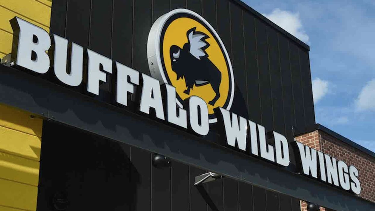 Knife-wielding man tries to rob employee closing Buffalo Wild Wings for night. But she isn't about to play victim — and kicks him until he runs away.