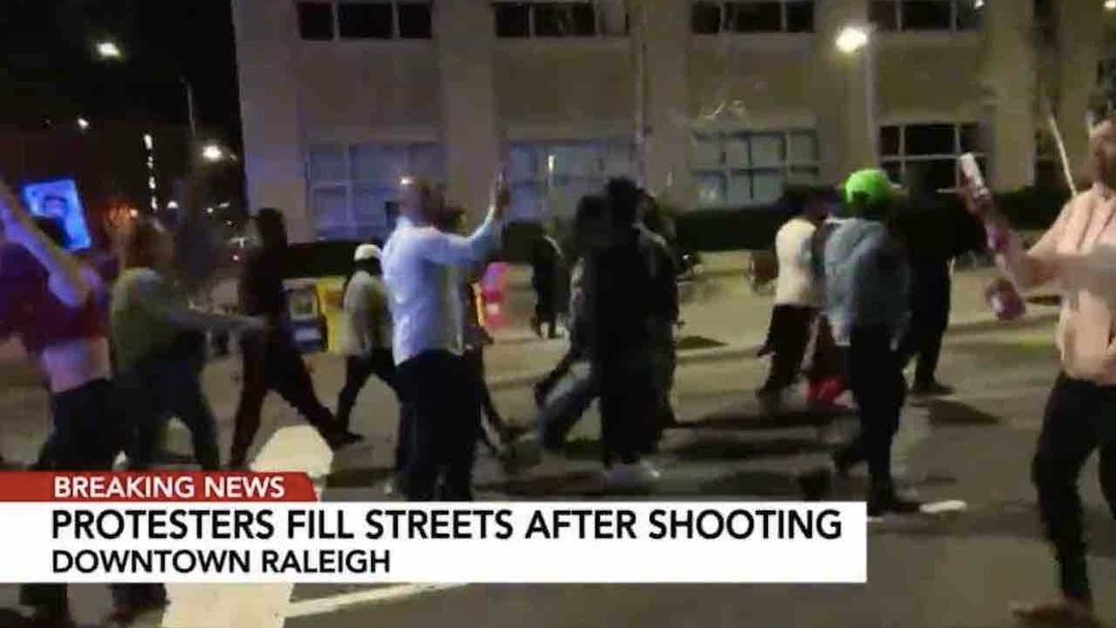 Rumor of police shooting unarmed teen in back sparks violent protests, flag burning, property damage. The rumor proves false.