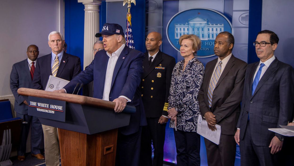 Reporter objects to Trump wearing 'USA' hat during press conference, gets destroyed on Twitter