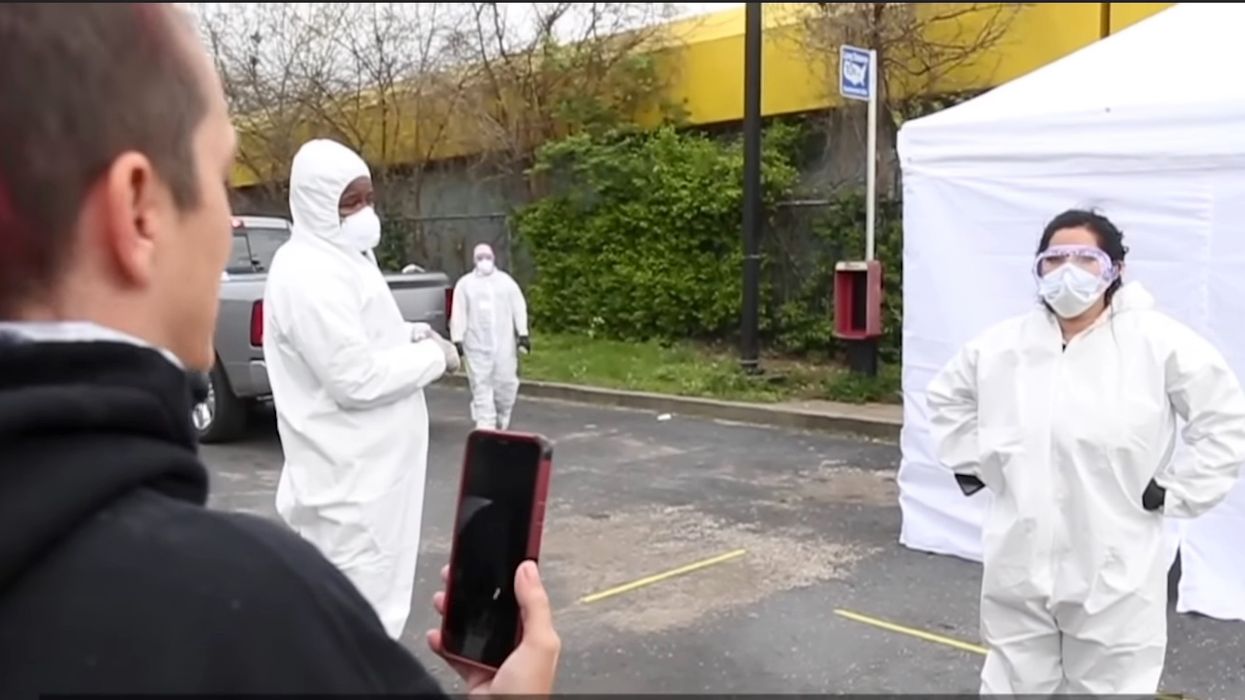 Dramatic video shows angry Louisville residents chasing away workers running fake coronavirus testing site