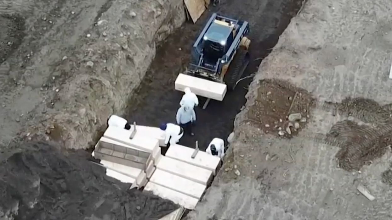 No fewer than 40 caskets were buried in a mass grave on NYC's Hart Island on Thursday
