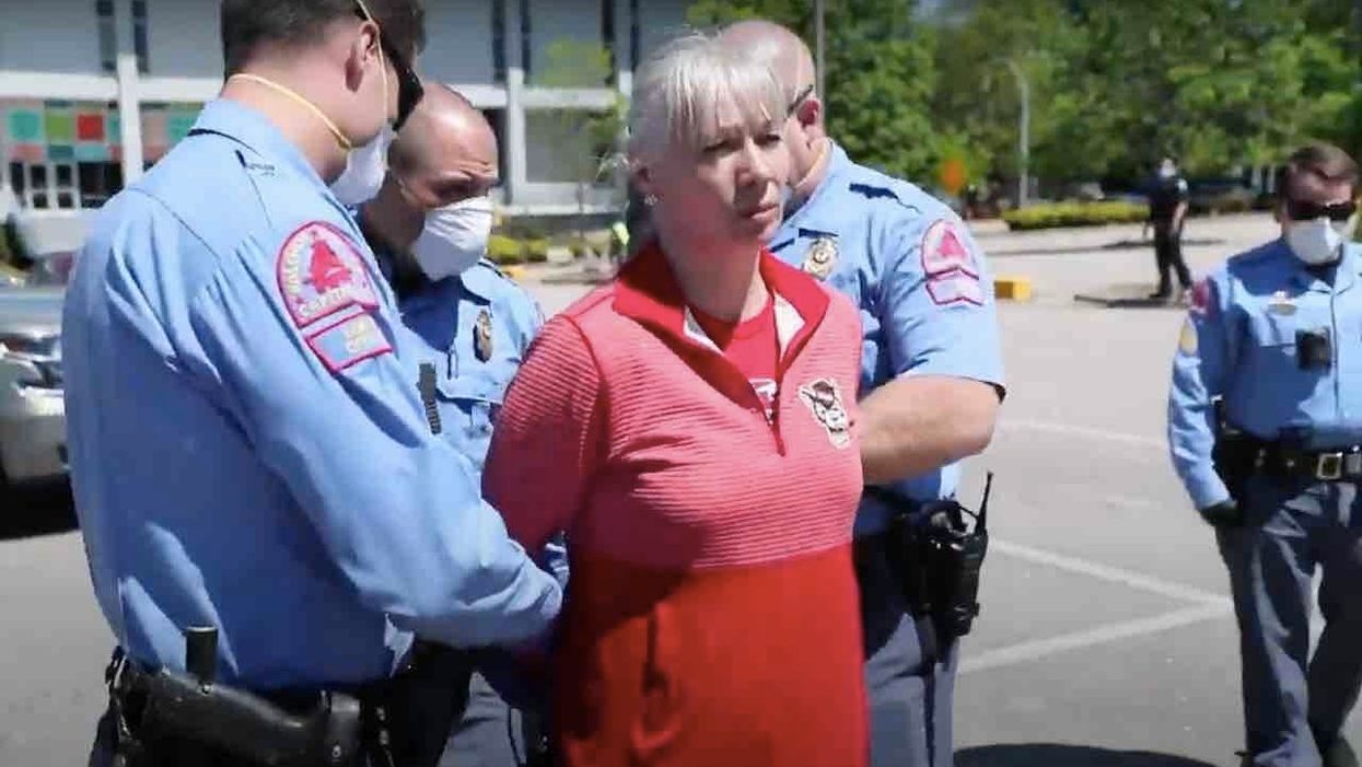 Police declare 'protesting is a non-essential activity' as woman is arrested for failing to disperse at rally to reopen NC economy