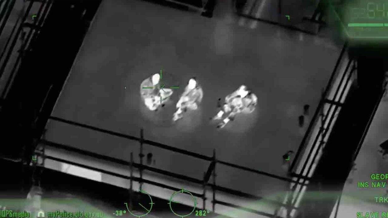 Helicopter apparently equipped with night vision nabs social distancing violators on Australian rooftop — and it's all on video
