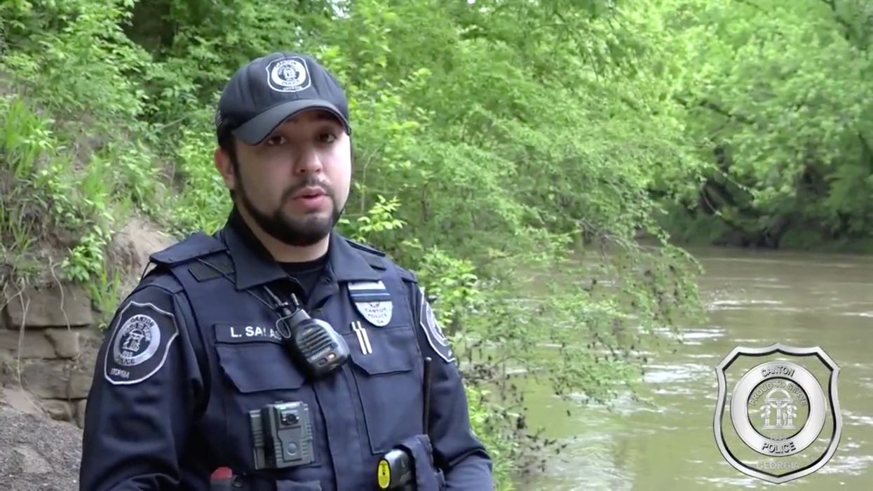 Policeman lauded as hero after he rescues 2 teens caught in a raging river