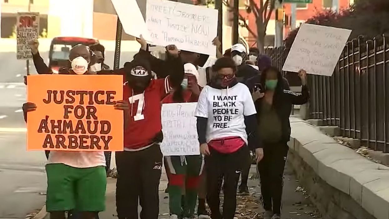 Father and son charged with murder of Ahmaud Arbery after public outcry over disturbing video