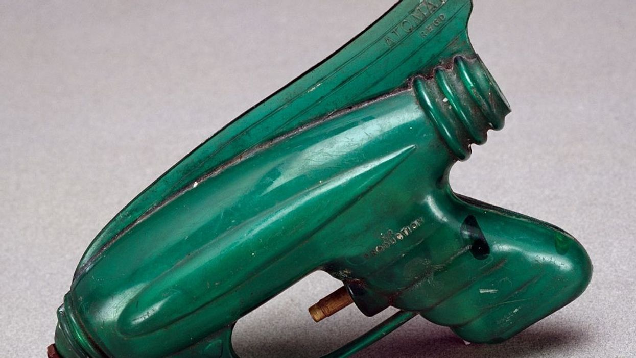 Priest who uses squirt gun to bless churchgoers with holy water has gone viral with memes