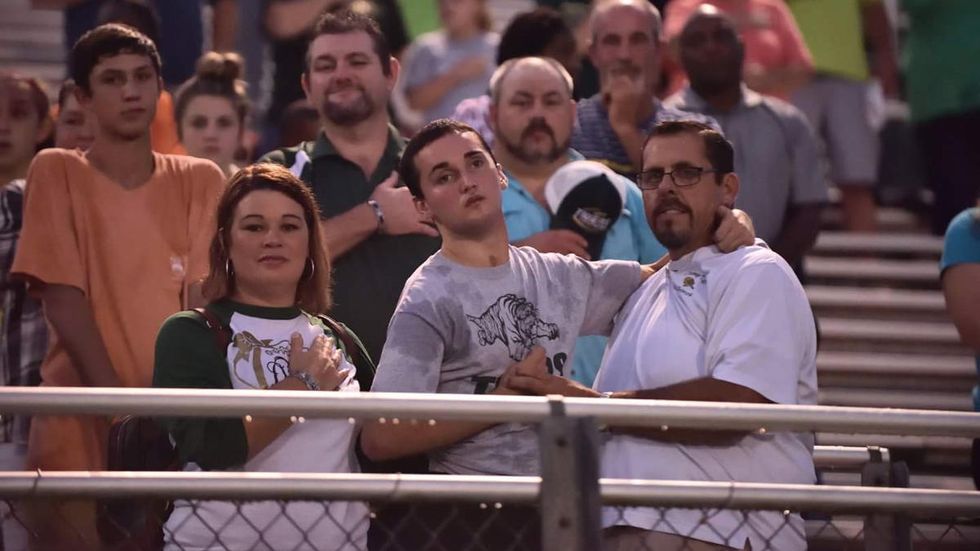 Teen makes miraculous first stand during national anthem
