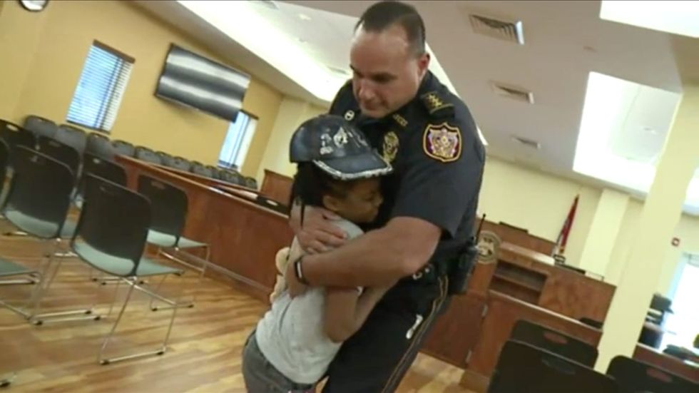 7-year-old hugs cops in half the country