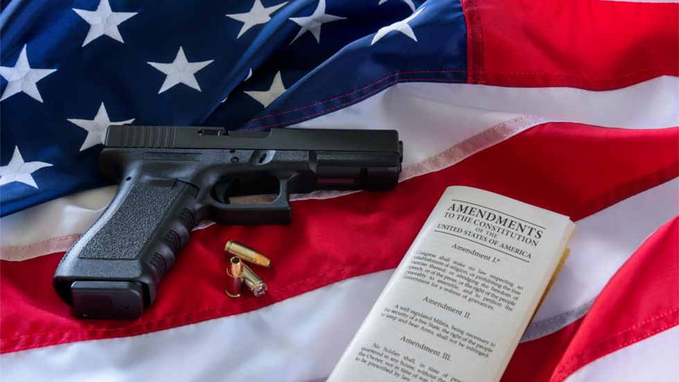 Armed dad kills masked gunman who opened fire at Birmingham McDonald's