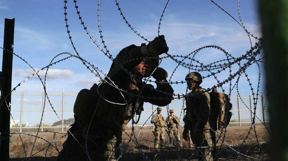 Military's mission doesn't include enforcement, so smugglers cross Rio Grande right in front of them