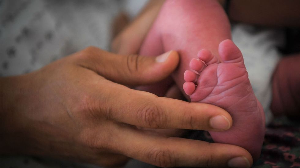 Doctors repeatedly asked if she wanted an abortion. She ignored them and gave birth to a health baby boy