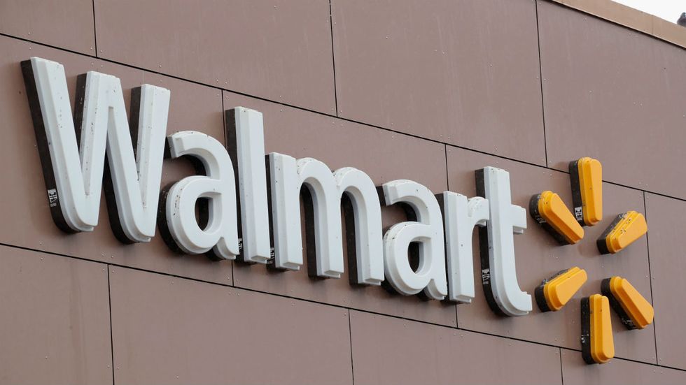 Who is Walmart trying to please with its new gun policies?