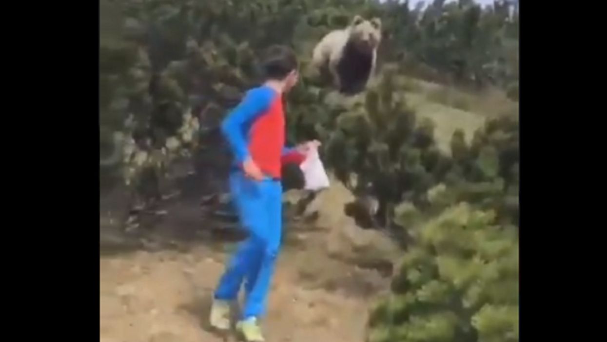 Watch: 12-year-old boy maintains his composure while being stalked by giant bear