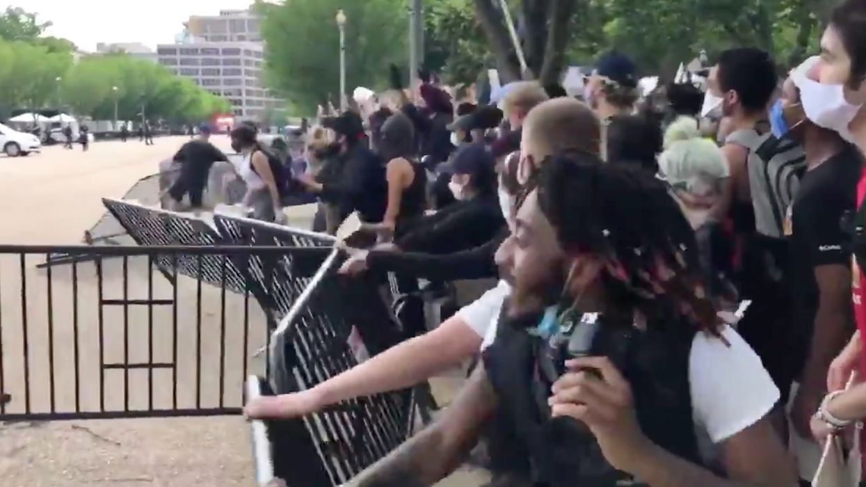 White House goes on lockdown after protesters knock down barriers outside