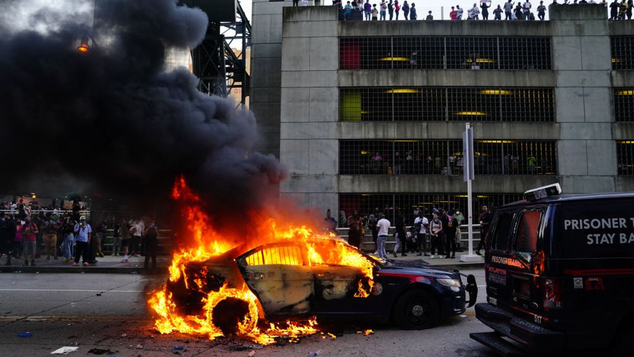 VIDEO: Fiery riots erupt in cities across the country as tensions flare and protests turn violent