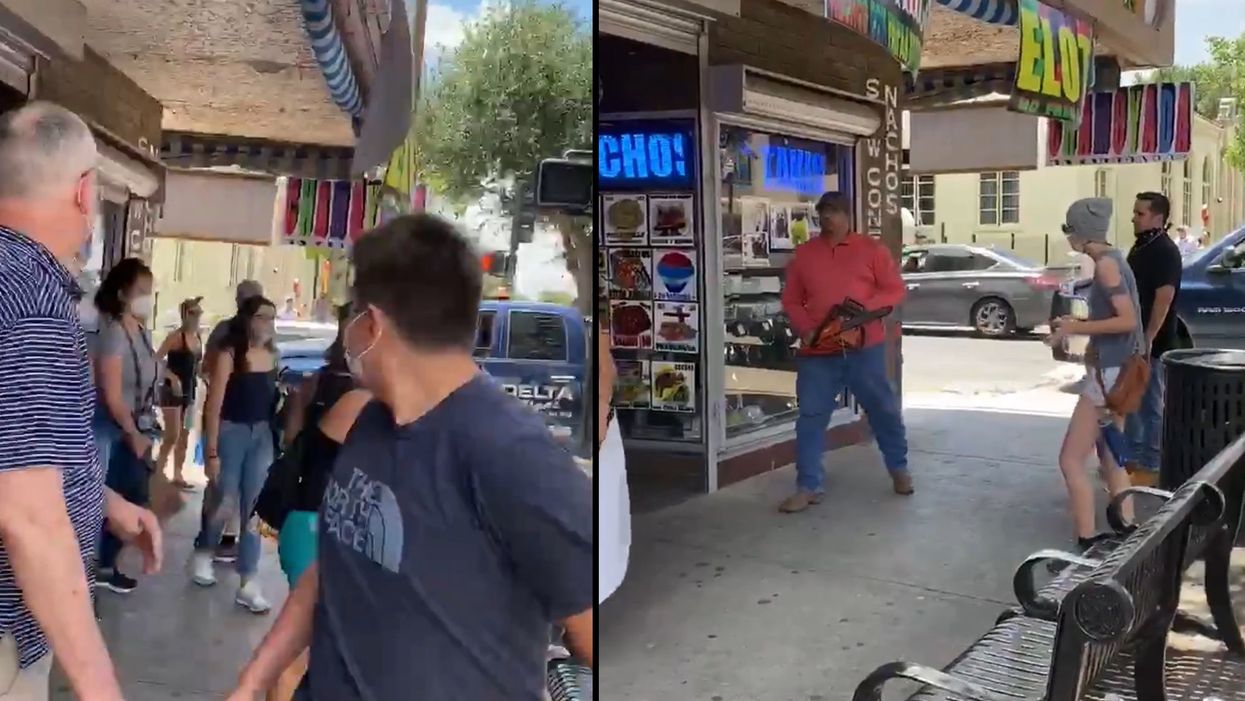 Viral video shows man threatening protesters with a chainsaw and yelling racist epithets; police make arrest