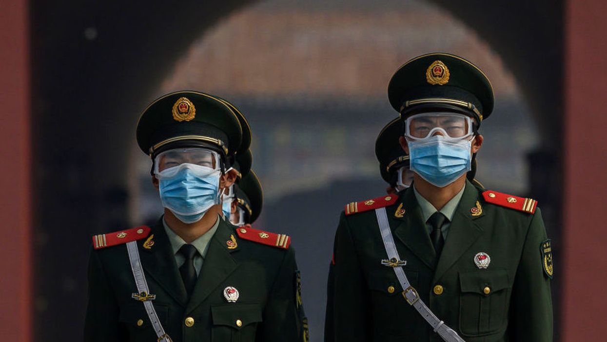 Chinese capital district in 'wartime emergency mode' after COVID spike originating at major food market